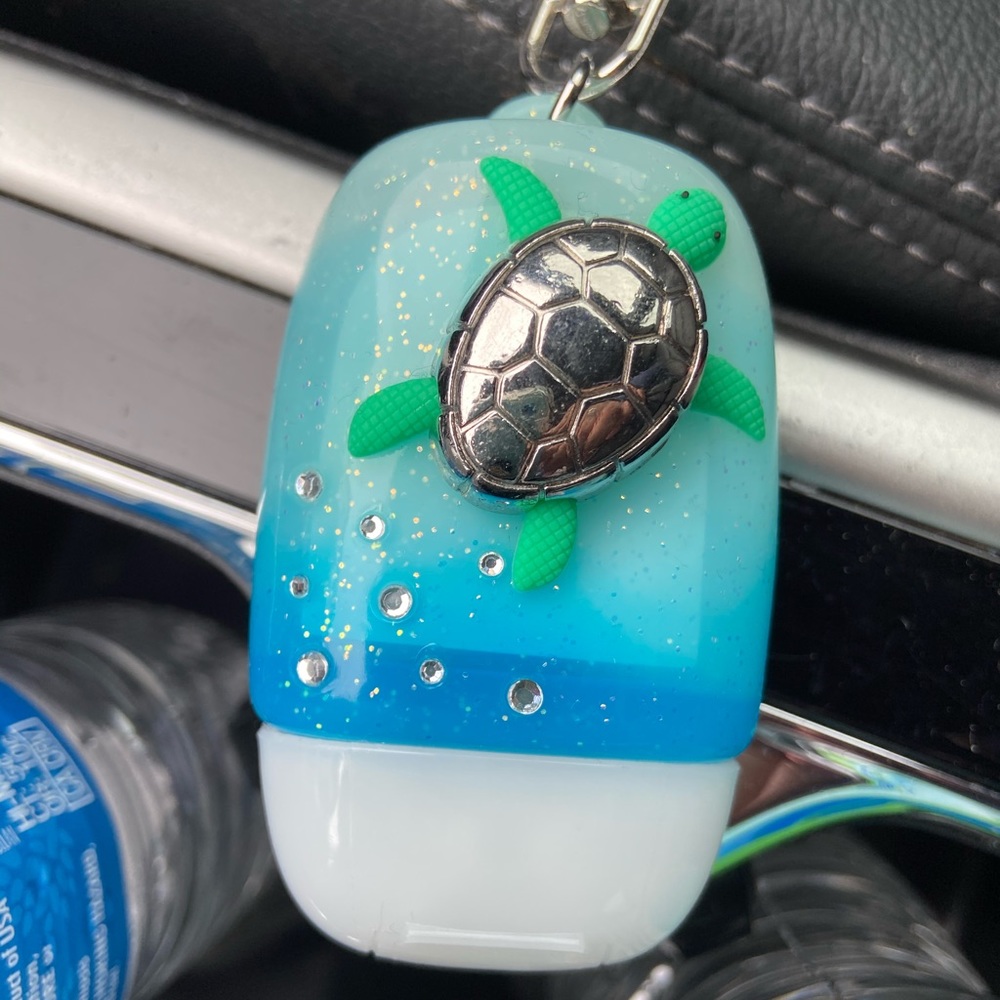 Hand sanitizer holder